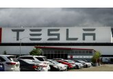 Tesla signals more price cuts ahead as report warns of slump in demand for new electric cars