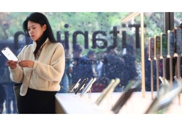 Apple sales dip again despite iPhone boost
