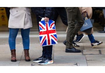 UK economy fell into recession after people cut spending