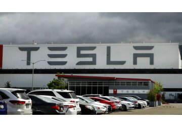 Tesla signals more price cuts ahead as report warns of slump in demand for new electric cars