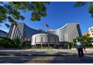 Banca centrală a Chinei semnalează o posibilă relaxare a măsurilor monetare pe măsură ce se acumulează tot mai multe riscuri economice